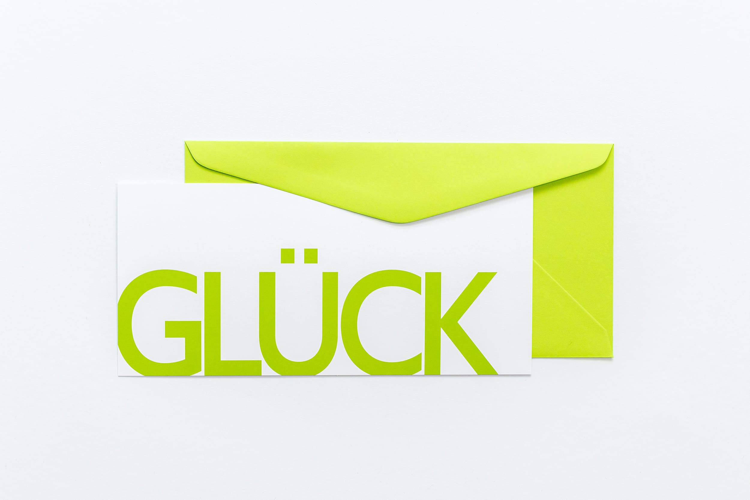 Grußkarte "GLÜCK" mit grünem Briefumschlag